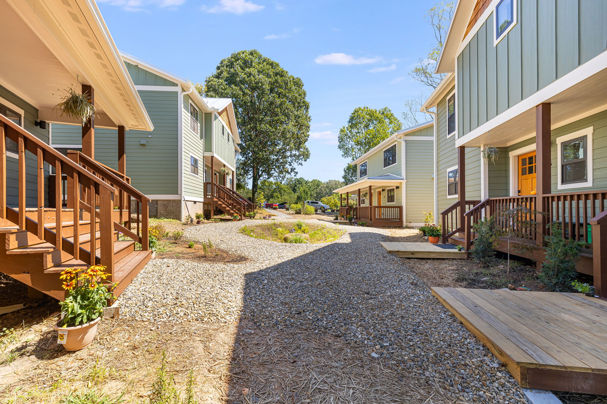 Wood walkways link the front porches across the courtyard